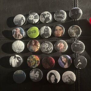 Buttons Collection with Black, Green, Red, and White Designs